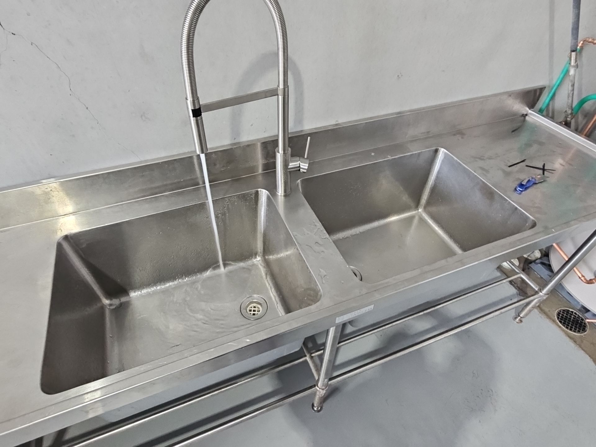 Commercial kitchen sink and plumbing fixtures
