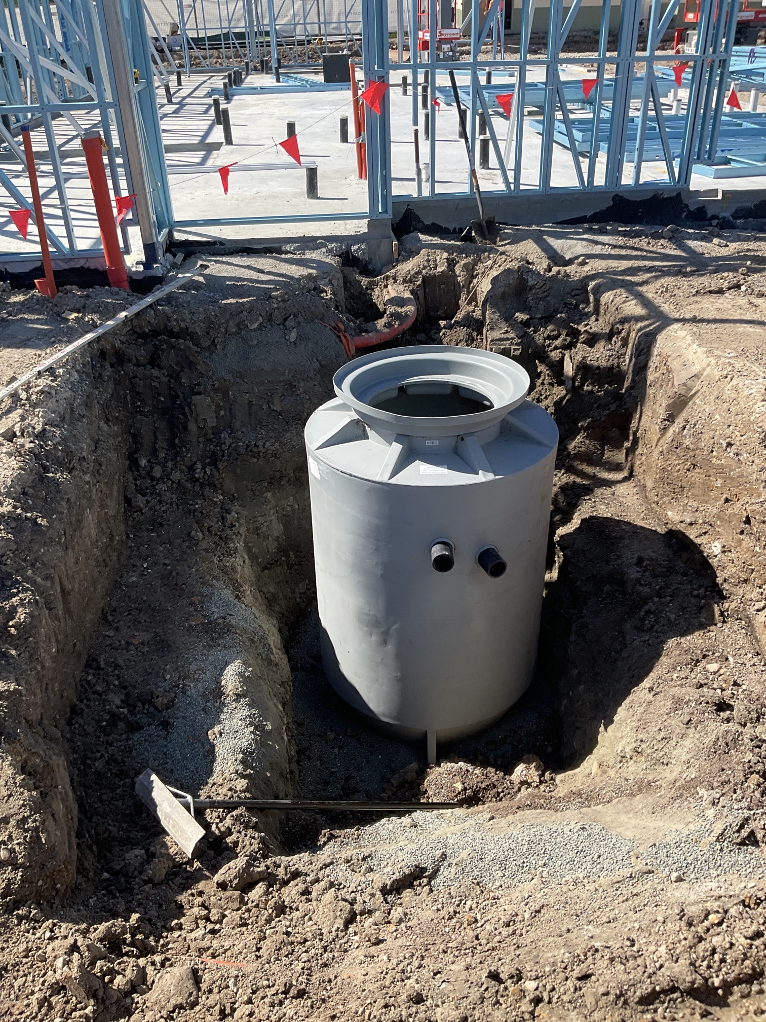 Underground tank installation on a commercial construction site